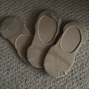 Three brand new pairs of no show socks.